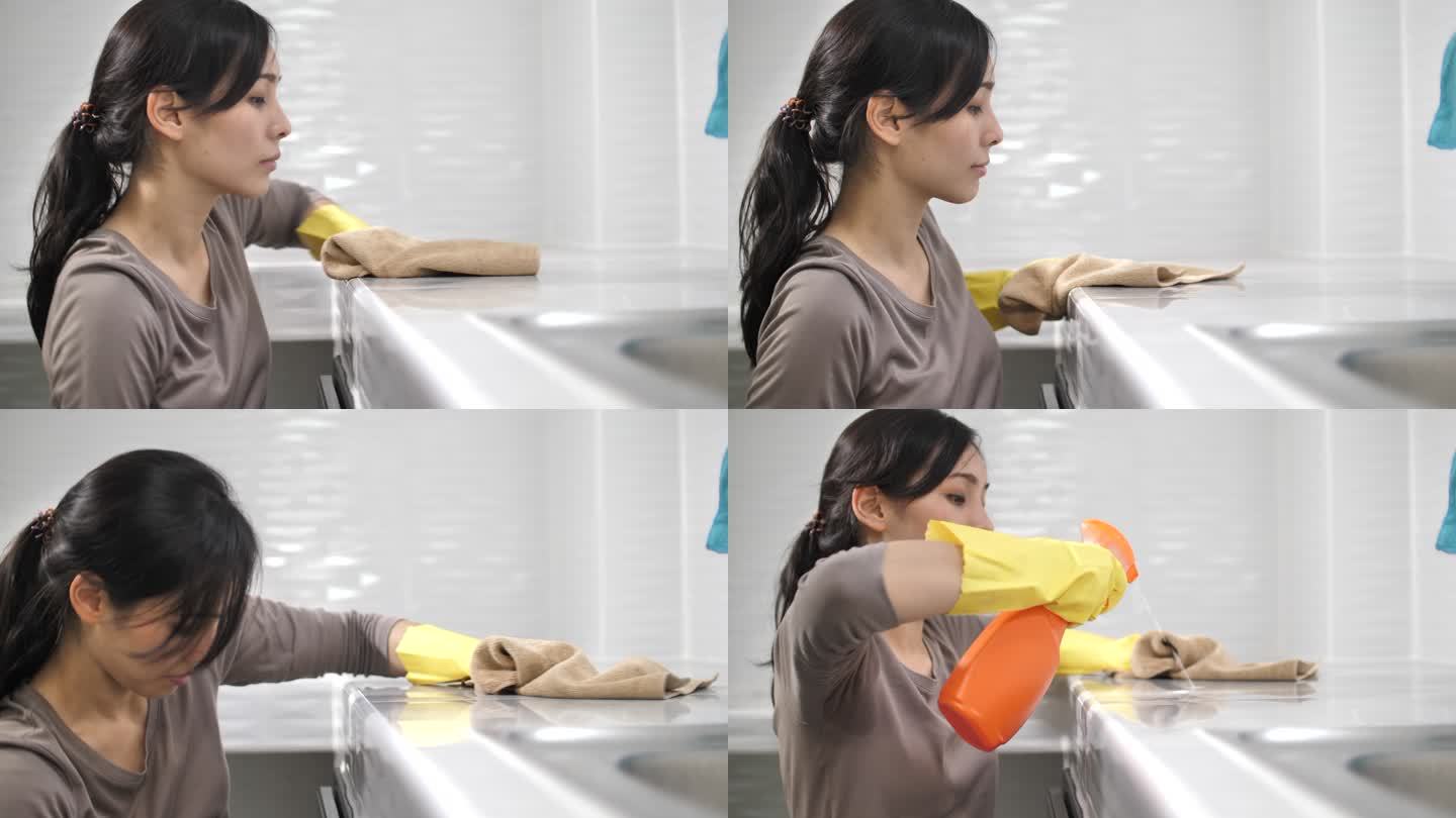 亚洲女人打扫不整洁的厨房