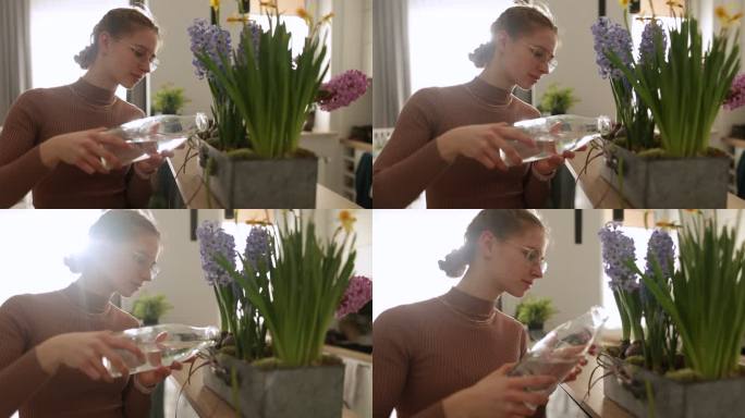 少女在花盆里浇花。