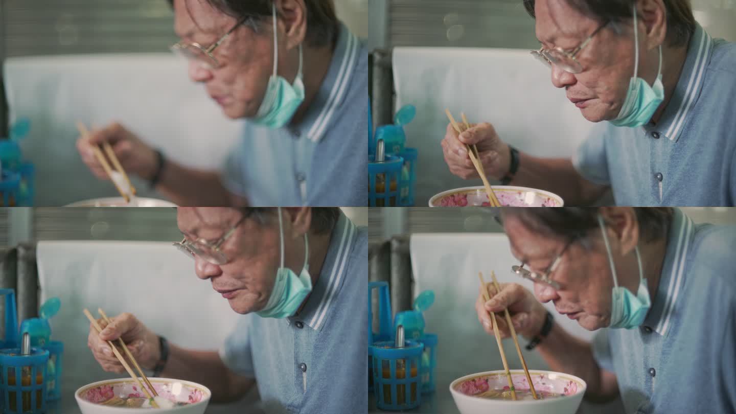 老人用筷子吃早餐吃东西困难