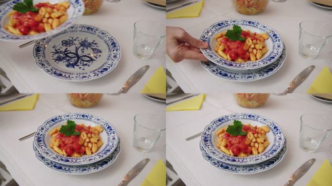 餐桌上用盘子盛着的新鲜意大利面