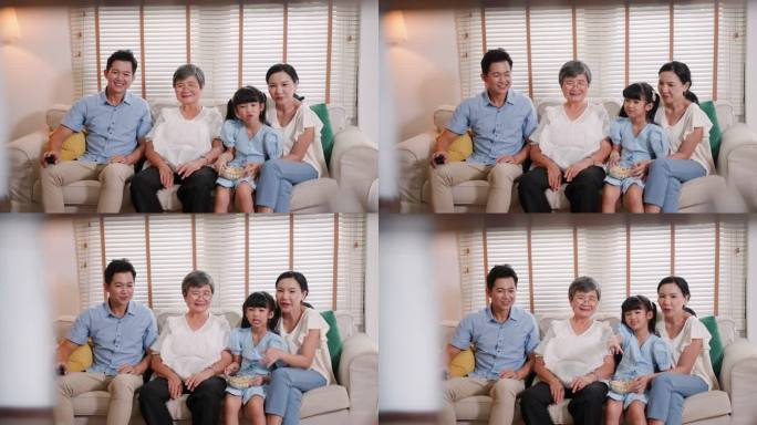 亚洲家庭，女儿和奶奶在家里沙发上看电视