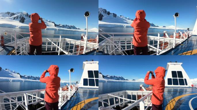 女子在南极船上拍照