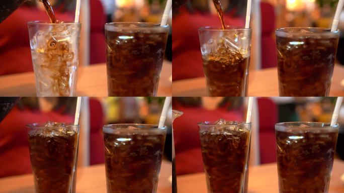 4K镜头在餐厅里倒冰可乐。