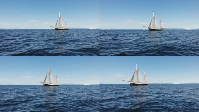 帆船在阳光明媚的蓝海格陵兰岛航行