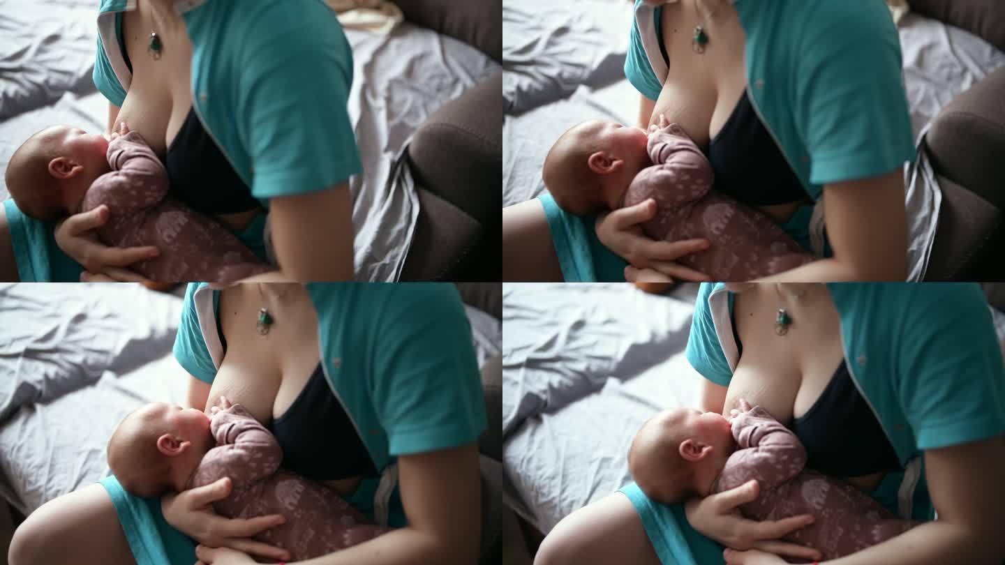 在家照顾新生儿。喂奶吮吸吸奶
