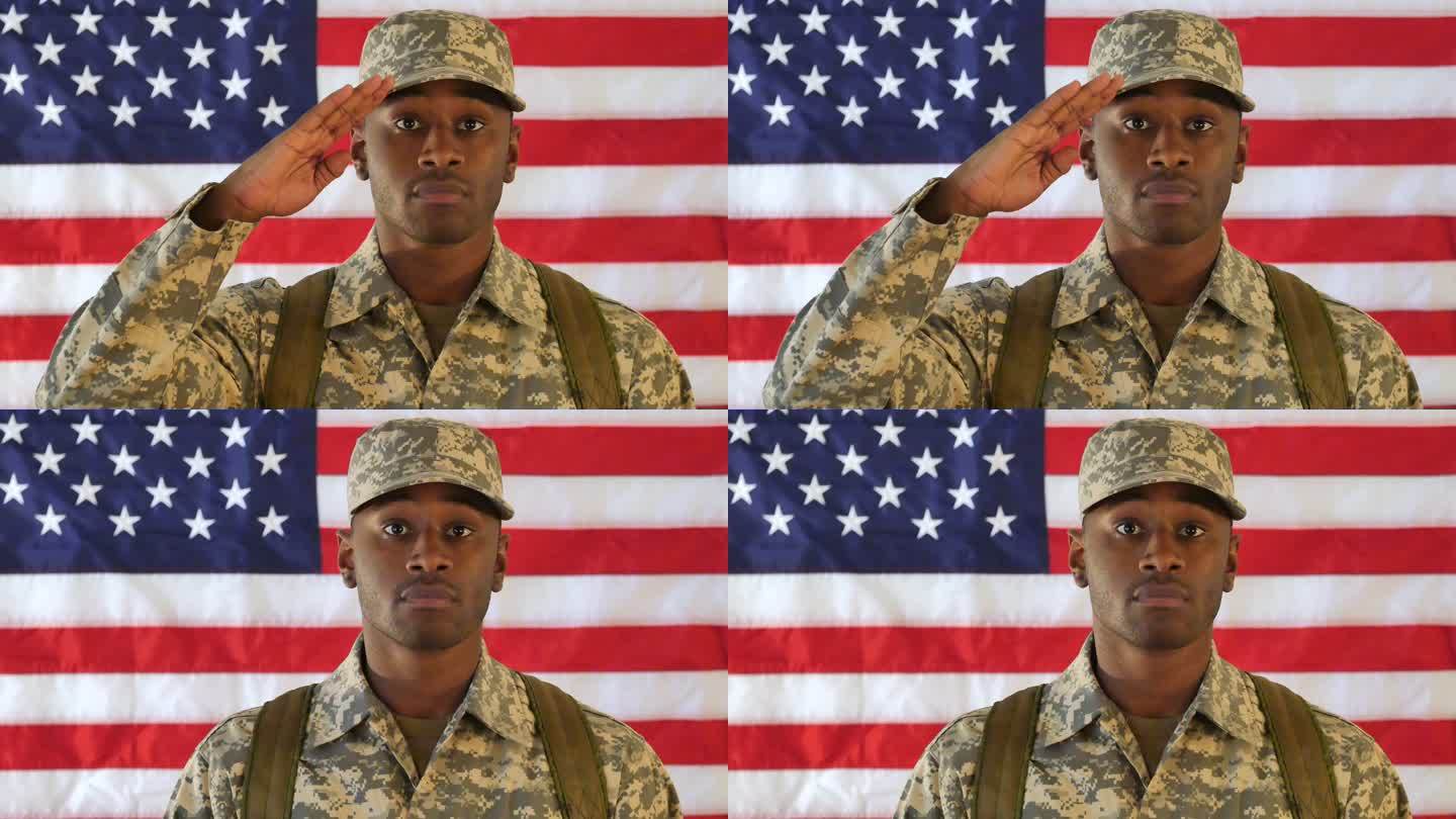 骄傲的美国士兵站在美国国旗前敬礼
