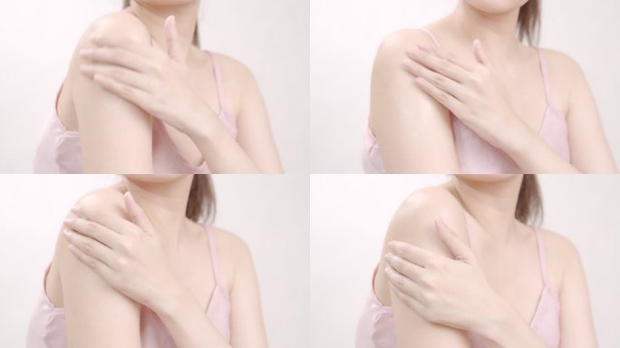 亚洲成年女性用手在肩上涂抹保湿霜。身体护理理念。