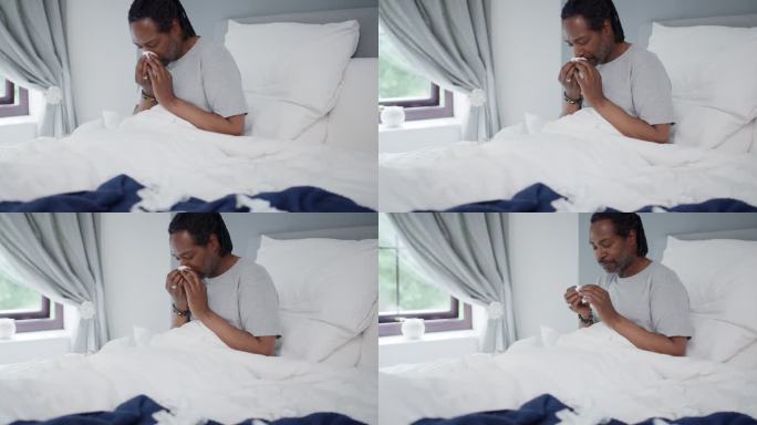一名患有流感的成年男子在家中床上擤鼻涕的4k视频片段