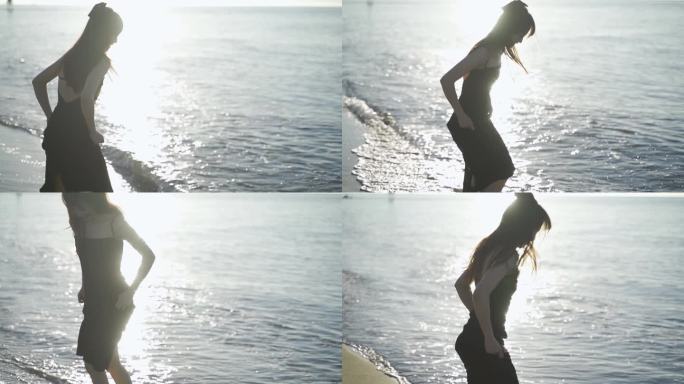 阳光下美女跑向海边玩耍踢海水欢快女孩少女