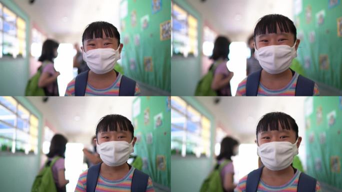 学校走廊里一个女孩的肖像——戴着防护面罩