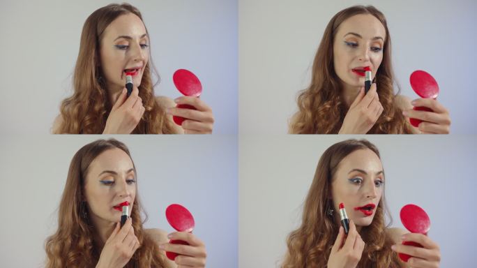 女人涂了很多口红照镜子化妆涂抹唇膏操作失