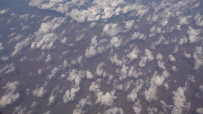 飞机上穿过云层航拍祖国辽阔山河大地