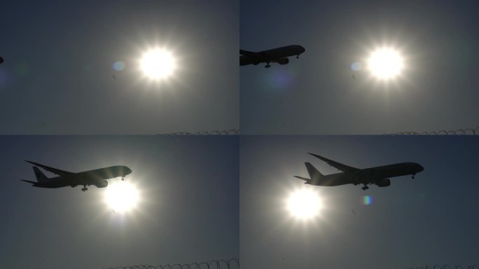 飞机慢速度穿过太阳降落剪影