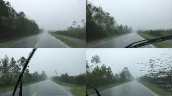 雨刷器无法清除盲雨的乡村森林道路上的驾驶员视野