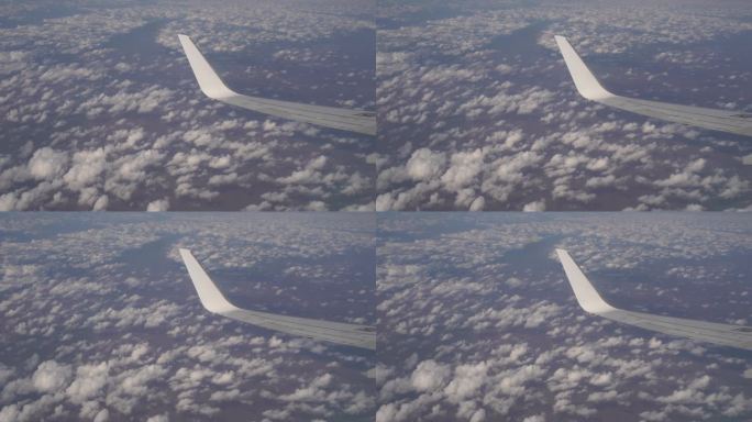飞机上穿过云层航拍祖国辽阔山河大地
