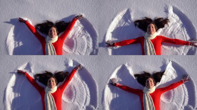 制作雪地天使的年轻女子