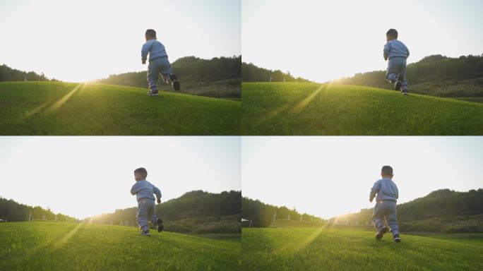 小男孩草地逆光奔跑儿童节素材快乐童年时光