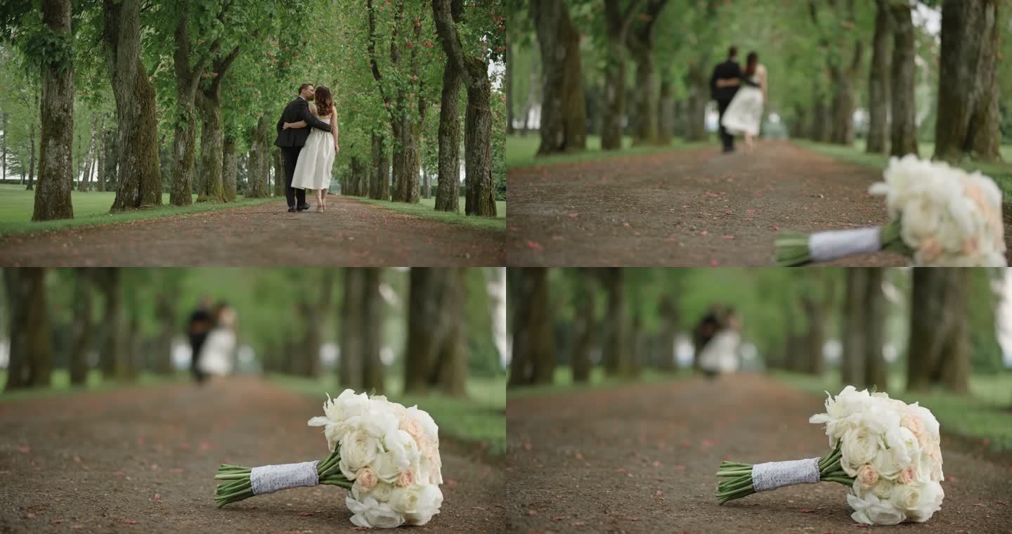 SLO MO新娘和新郎在一条林荫道上散步
