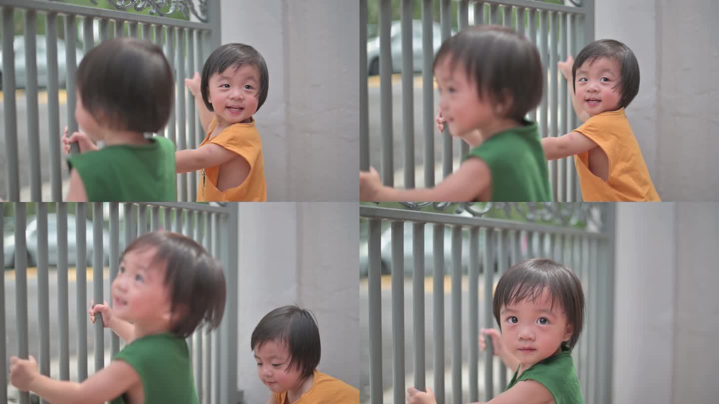 夏季周末，亚裔中国男婴在屋前玩耍