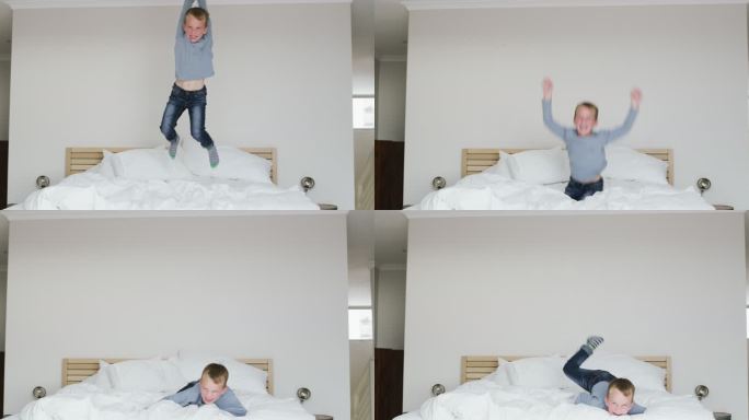他玩得很开心开心得跳起来小男孩床上