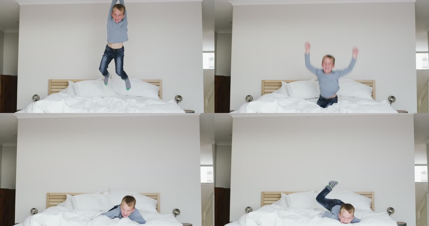 他玩得很开心开心得跳起来小男孩床上