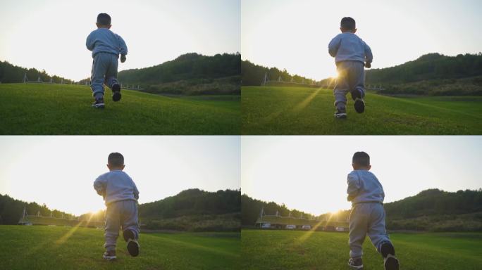 小男孩草地逆光奔跑户外玩耍冲向妈妈儿童节