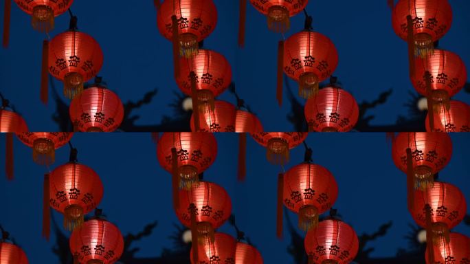 在寺庙过年时，中国灯笼在夜晚点亮