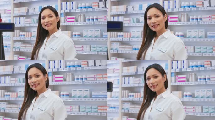 一位微笑的亚洲女药剂师站在柜台后面的肖像