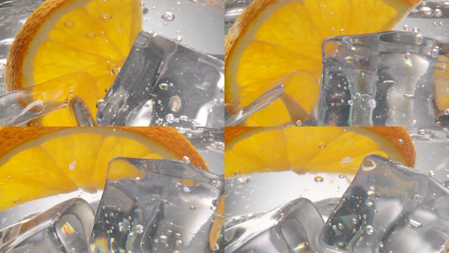 橙子片掉在水中，里面有冰块