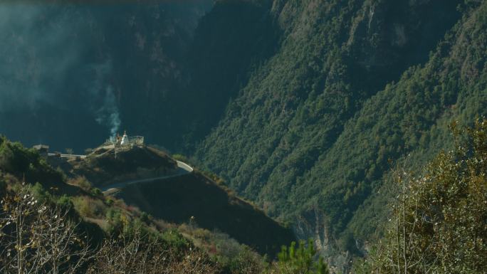 航拍高山上的藏式白塔佛塔经幡