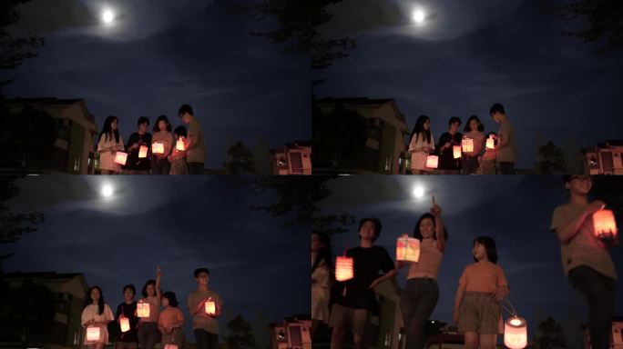 亚裔中国母亲带着孩子和侄子举着纸灯，庆祝中秋节。