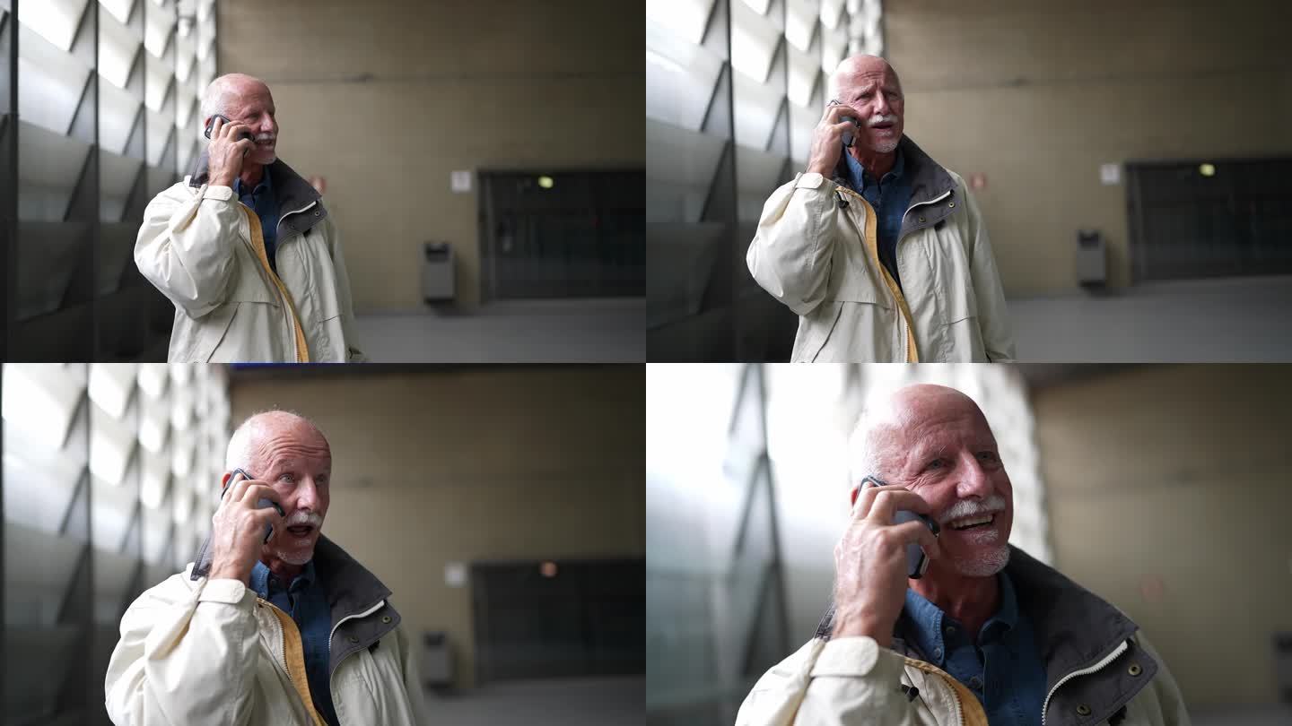 一位在地铁站打手机的老人