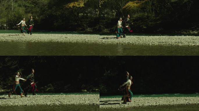 藏族情侣牵手河边奔跑