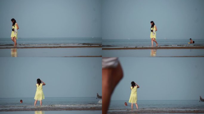 女孩在海边拍照
