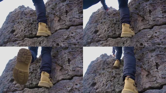 登山脚步特写爬上山顶户外探险攀岩运动鞋