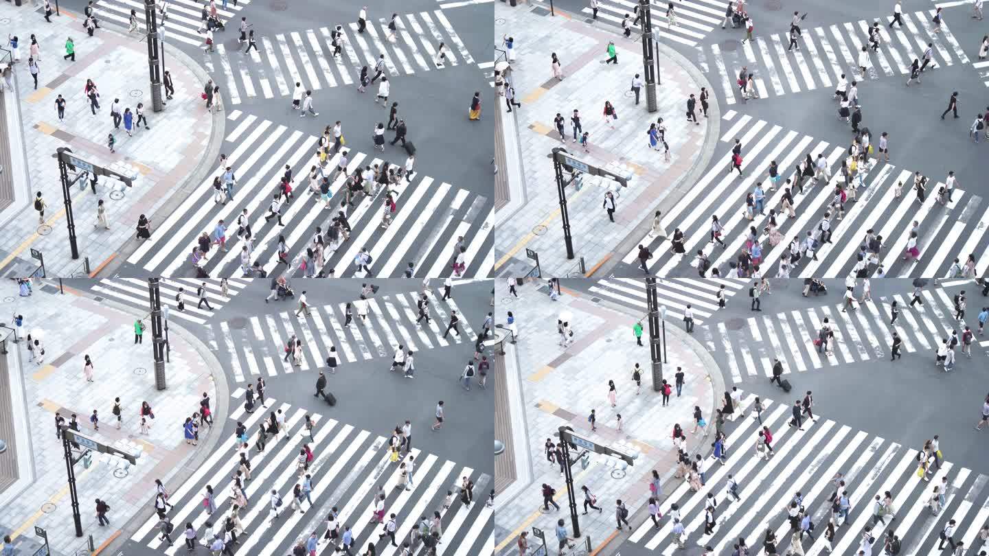 日本东京，人群穿过斑马线。