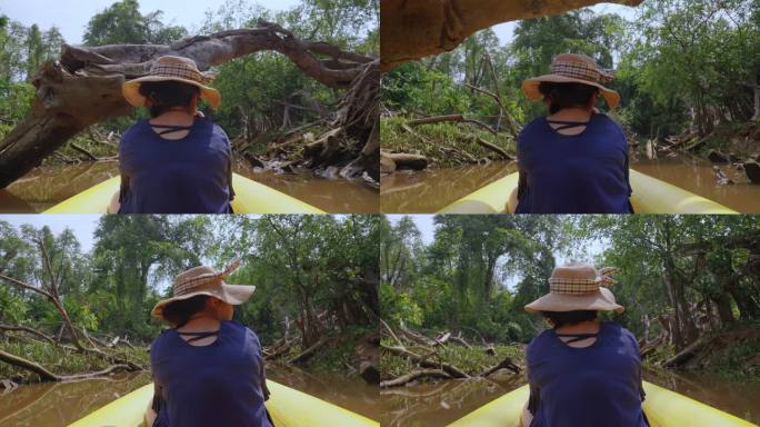 自然旅游活动旅行皮划艇，女子划桨透明皮划艇在泥炭沼泽森林湿地，亚洲女性休闲放松，在夏季探索红树林