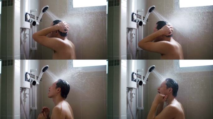 亚洲年轻男子在浴室用慢动作淋浴。