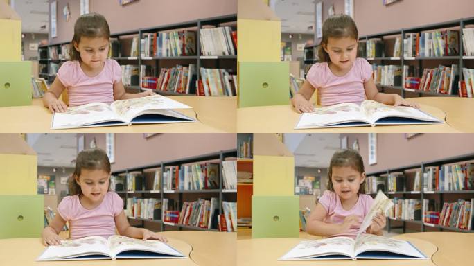 DS小女孩在公共图书馆的儿童桌旁读书
