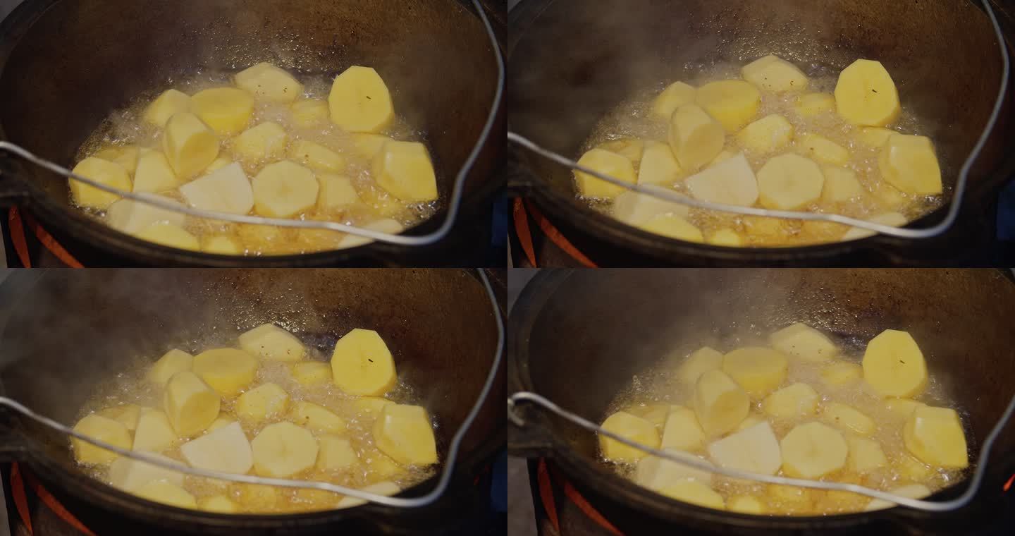 在大锅里用洋葱和肉煮土豆。