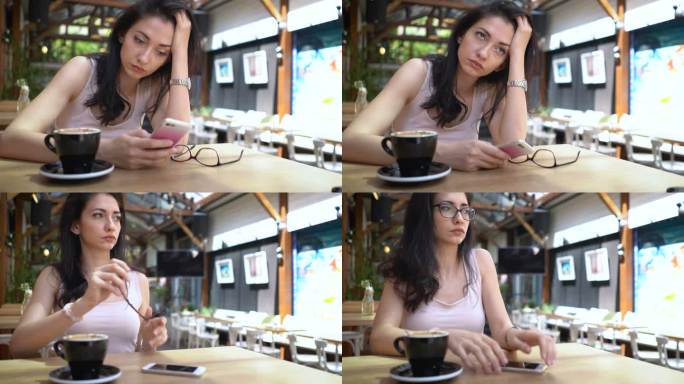 一个抑郁的女人独自坐在咖啡馆里用手机发短信