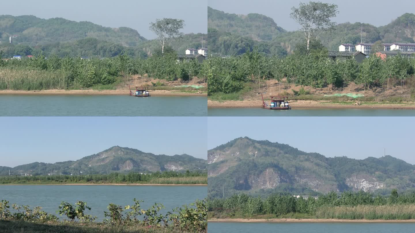 自然生态静静的河水、远山、岸边小船