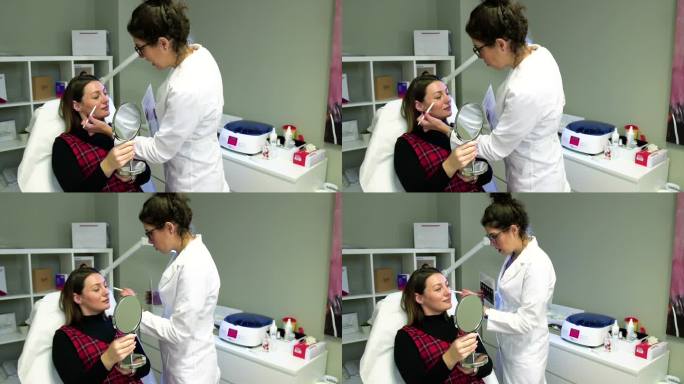 在美容诊所接受微针嫩肤治疗的年轻女性。股票视频