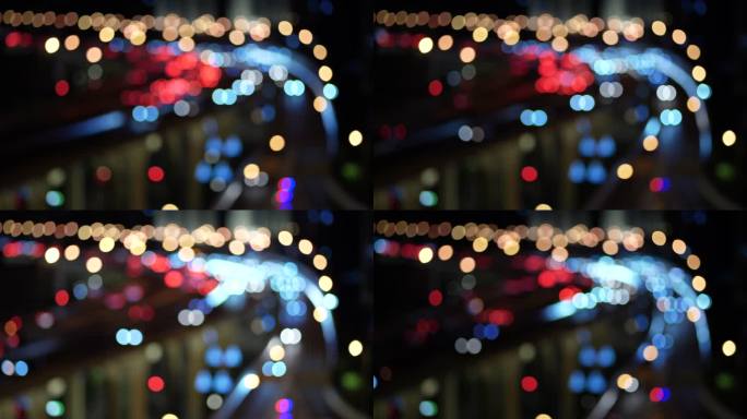 天桥和夜间城市交通的T/L散焦视图