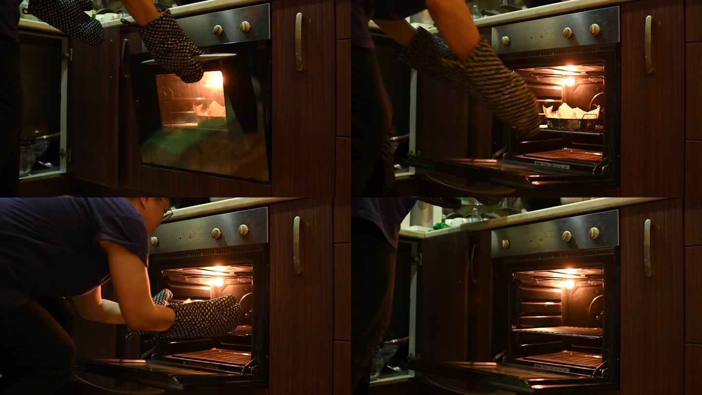 一名亚裔中国中年妇女在厨房烤箱中从烤箱中取出蛋糕托盘准备用餐