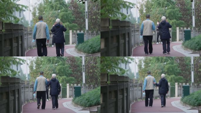 老年夫妻步道散步老人背影