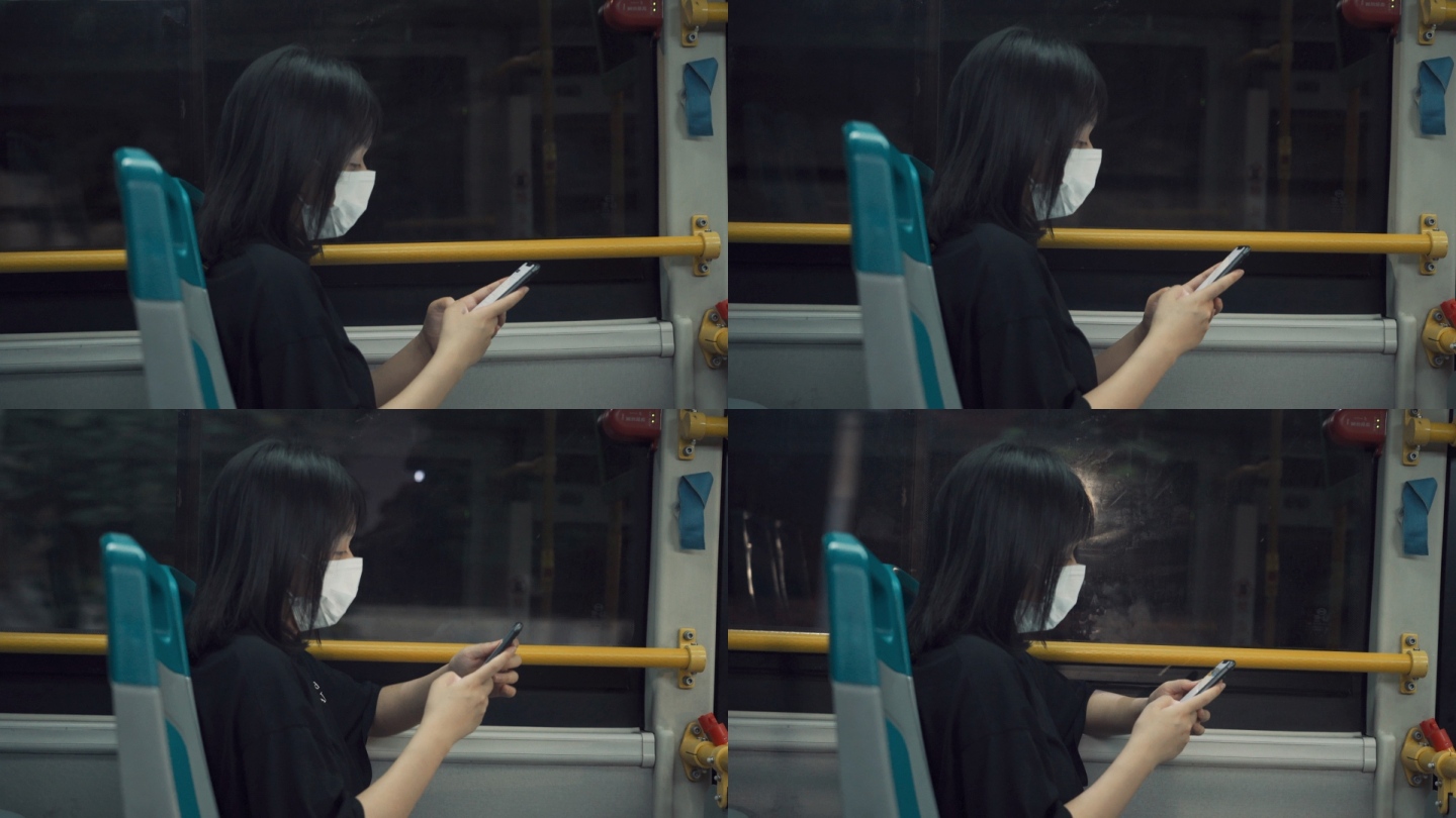 公车上玩手机的女孩