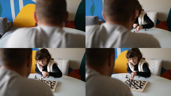 父亲观察女儿在国际象棋比赛中的动作