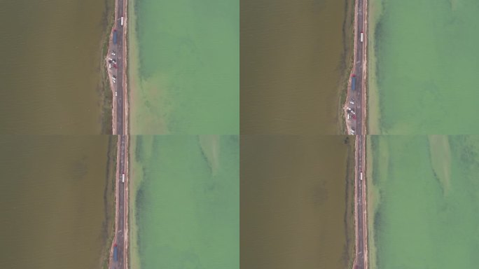 航拍青海柴达木盆地双色湖中心沿路跟车画面