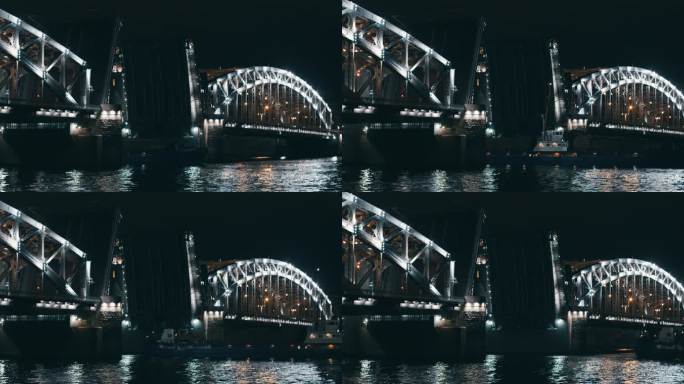 圣彼得堡彼得大帝的开放式吊桥，夜晚灯光明媚，一艘驳船穿过